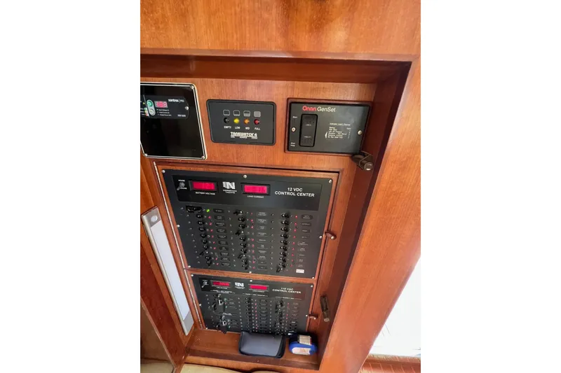 Slide: The Image of Electrical control panel on a 2006 Norseman 480S boat, featuring various switches and indicators. - 80