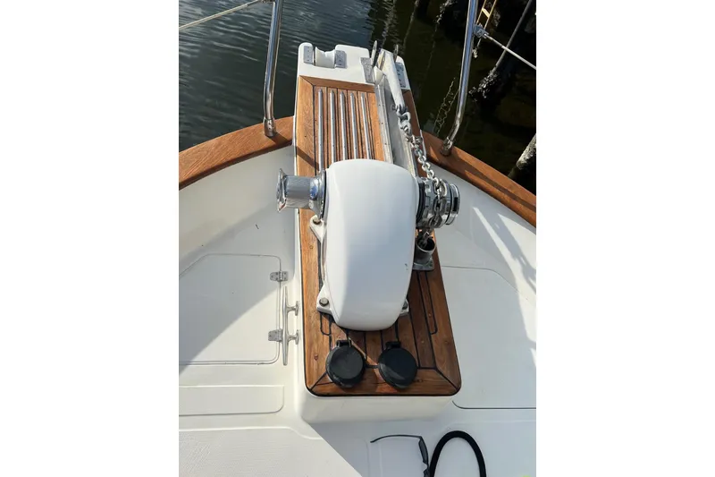 Slide: The Image of Anchor windlass on 2006 Norseman 480S yacht, featuring teak decking and stainless steel fittings. - 91