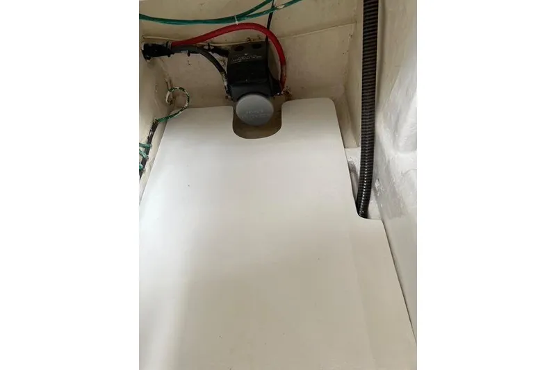 Slide: The Image of Interior view of a 2006 Norseman 480S boat compartment with wiring and equipment. - 99