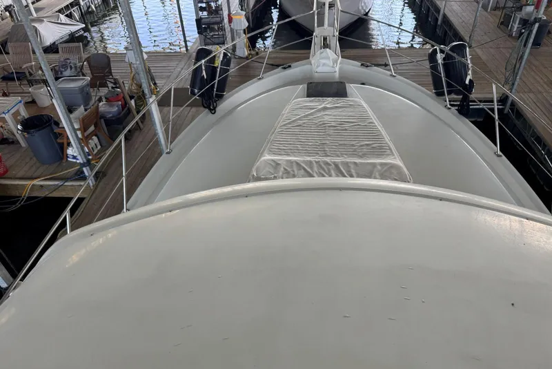 Slide: The Image of 1987 Carver 42 Aft Cabin Motor Yacht docked in marina, top deck view. - 20