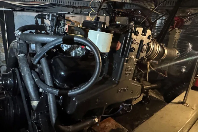 Slide: The Image of Engine room of 1987 Carver 42 Aft Cabin Motor Yacht, showcasing mechanical components. - 48