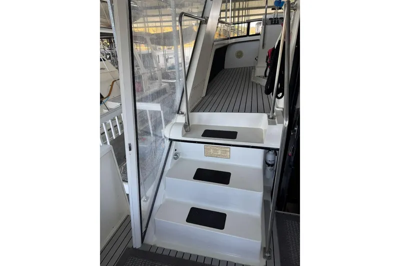Slide: The Image of 1987 Carver 42 Aft Cabin Motor Yacht interior stairs with sleek design and modern finish. - 13