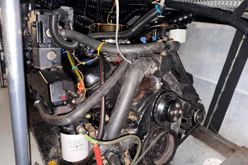 Slide: The Image of Engine compartment of a 1987 Carver 42 Aft Cabin Motor Yacht, showcasing mechanical components. - 47
