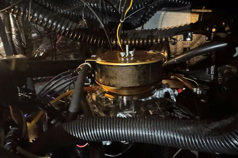 Slide: The Image of Engine compartment of 1987 Carver 42 Aft Cabin Motor Yacht, showcasing mechanical components. - 49