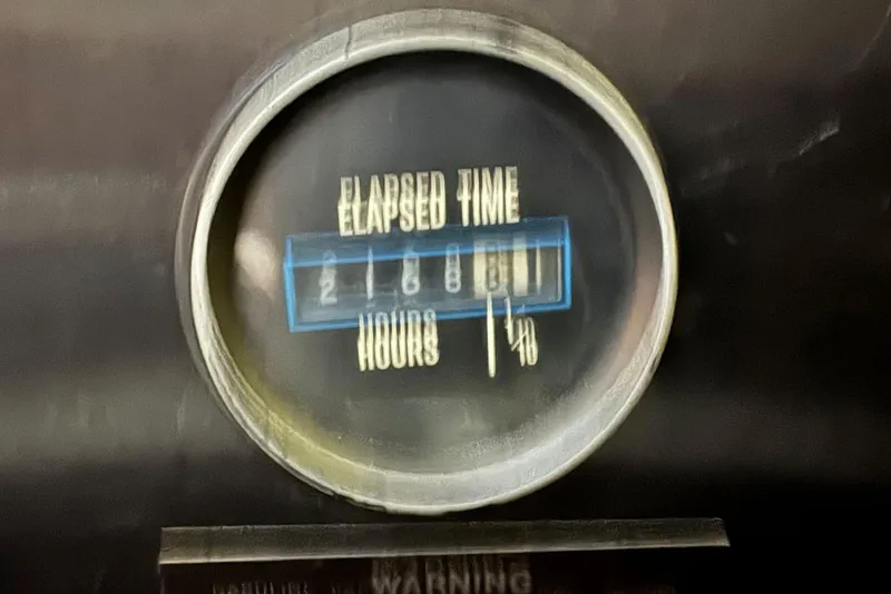 Slide: The Image of Elapsed time gauge showing 2,168 hours on 1987 Carver 42 Aft Cabin Motor Yacht. - 51
