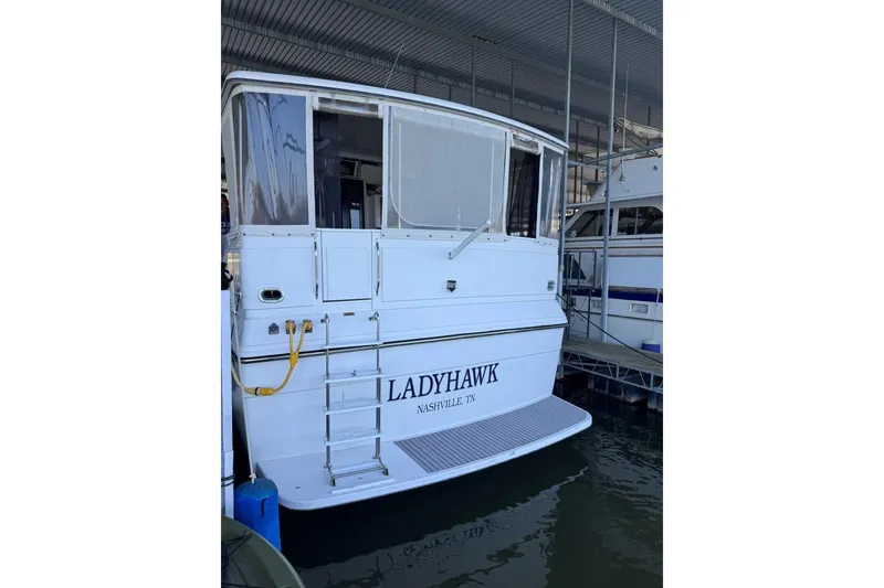 Slide: The Image of 1987 Carver 42 Aft Cabin Motor Yacht docked, named "Ladyhawk," in Nashville, TN. - 7
