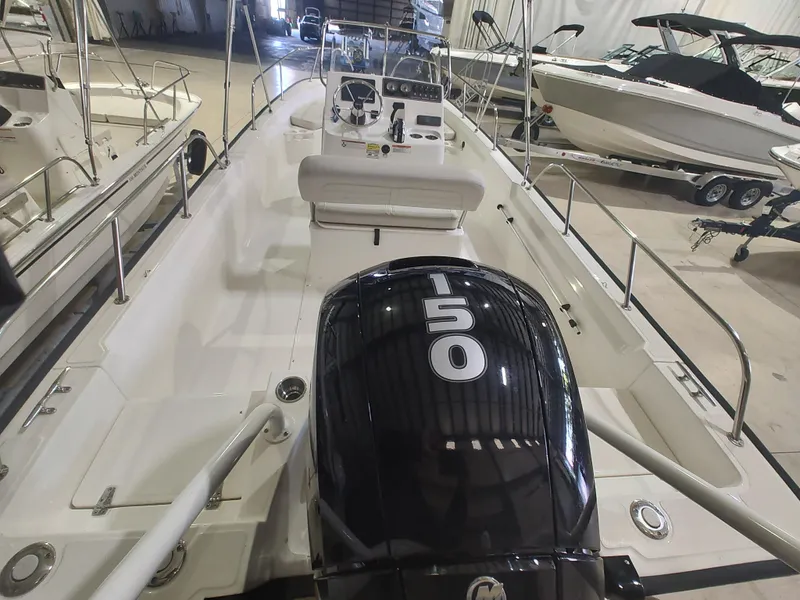 Slide: The Image of 2022 Boston Whaler 190 Montauk boat with 150 HP engine in showroom. - 19
