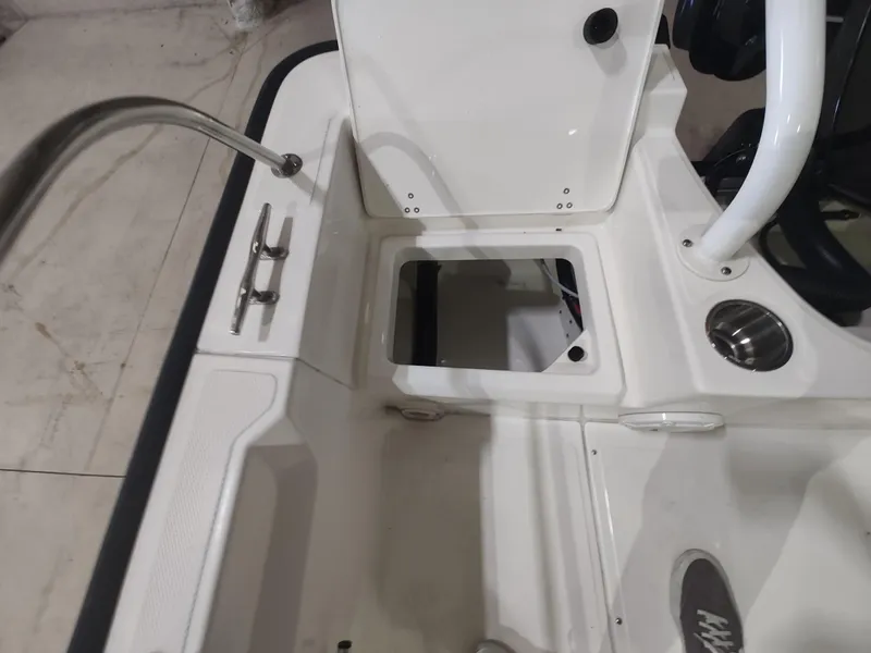 Slide: The Image of 2022 Boston Whaler 190 Montauk boat interior with open storage compartment. - 20