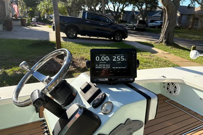 Slide: The Image of 2019 Skimmer Skiff 16'6" CC boat cruising on open water, aerial view. - 17