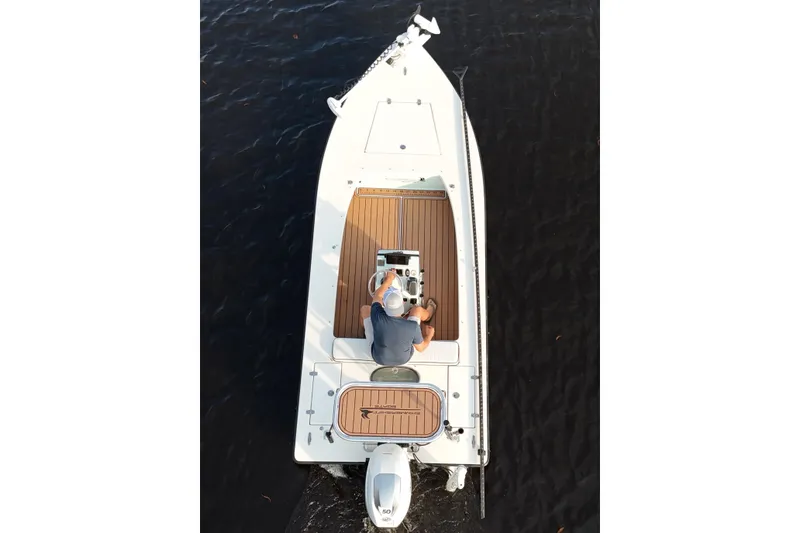 Slide: The Image of Overhead view of a 2019 Skimmer Skiff 16'6" CC boat on water. - 26