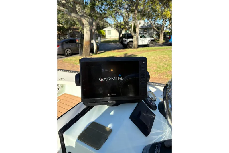 Slide: The Image of Garmin device on 2019 Skimmer Skiff 16'6" CC boat dashboard, outdoor setting. - 46
