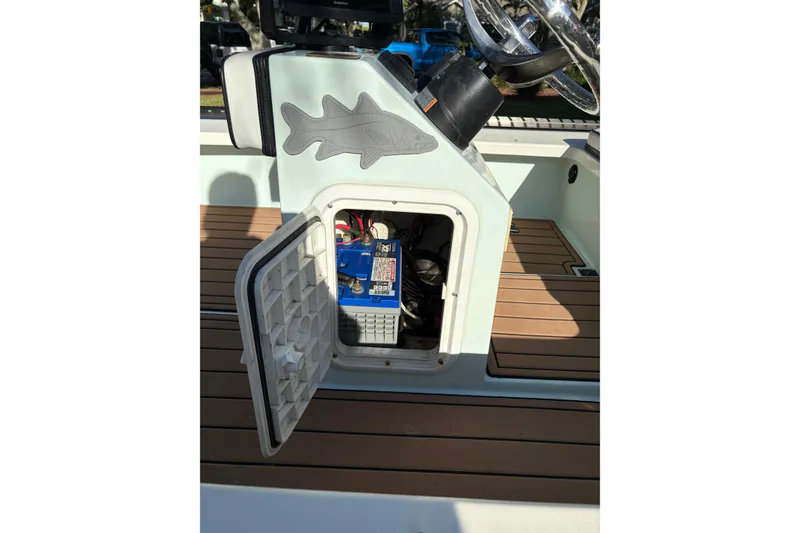 Slide: The Image of 2019 Skimmer Skiff 16'6" CC boat console with open storage compartment. - 47