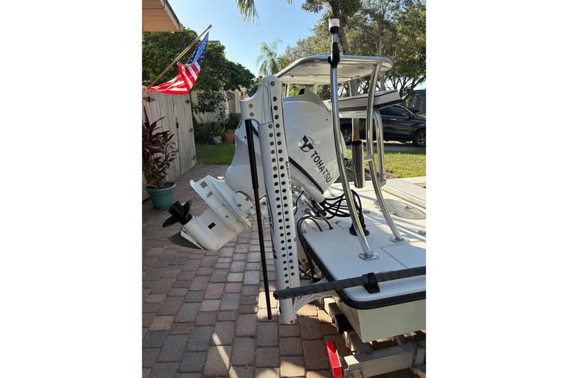 Slide: The Image of 2019 Skimmer Skiff 16'6" CC boat on water, featuring Tohatsu engine. - 5