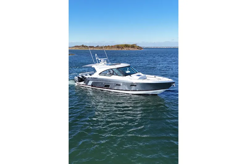 Slide: The Image of 2021 Formula 400 Super Sport Crossover yacht cruising on open water. - 12