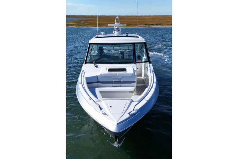 Slide: The Image of 2021 Formula 400 Super Sport Crossover boat cruising on open water. - 18