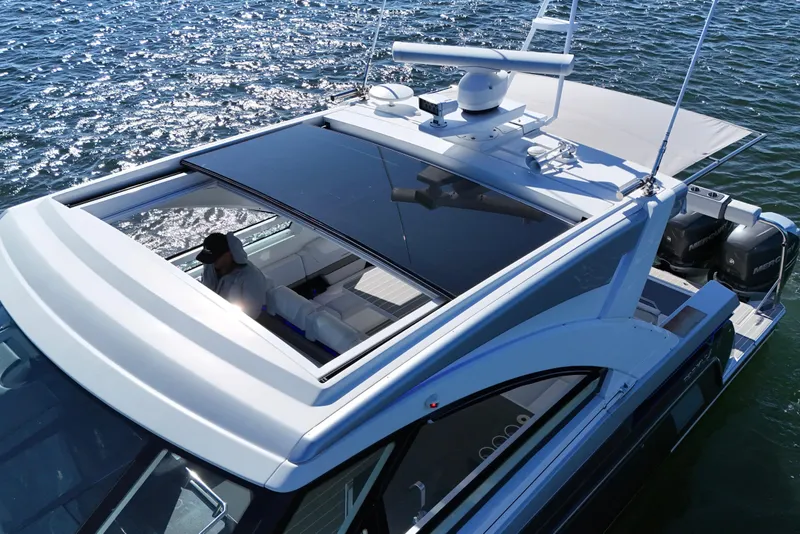 Slide: The Image of 2021 Formula 400 Super Sport Crossover yacht on water, featuring sleek design and modern amenities. - 23