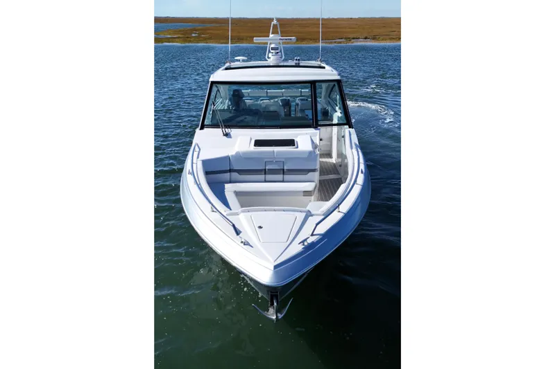 Slide: The Image of 2021 Formula 400 Super Sport Crossover boat cruising on open water. - 26
