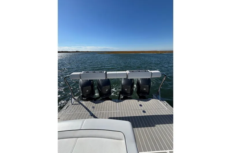 Slide: The Image of 2021 Formula 400 Super Sport Crossover boat with four powerful outboard engines on water. - 30