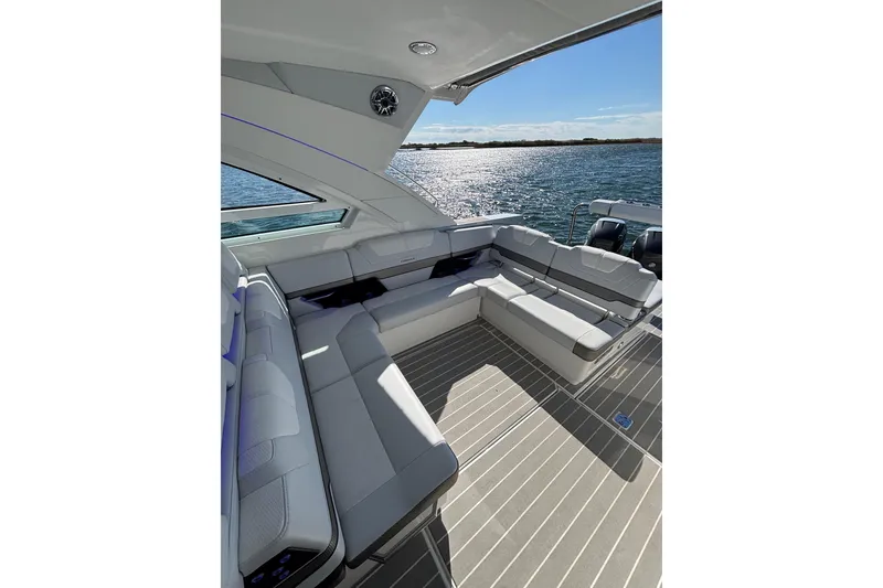 Slide: The Image of Luxurious seating area on 2021 Formula 400 Super Sport Crossover yacht, overlooking serene waters. - 31