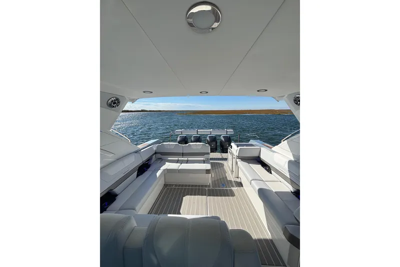 Slide: The Image of 2021 Formula 400 Super Sport Crossover boat interior with spacious seating and scenic water view. - 32