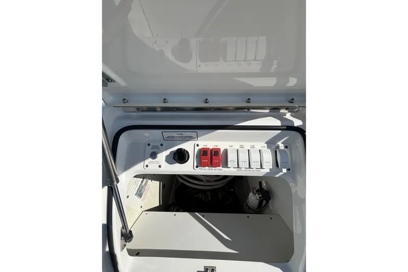Slide: The Image of Control panel of 2021 Formula 400 Super Sport Crossover boat, featuring switches and buttons. - 34