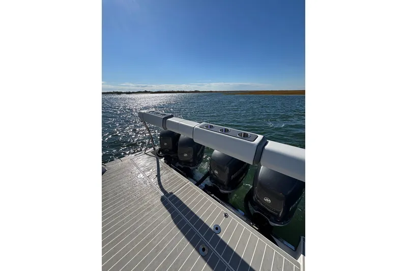 Slide: The Image of 2021 Formula 400 Super Sport Crossover boat with powerful outboard engines on a sunny day. - 35