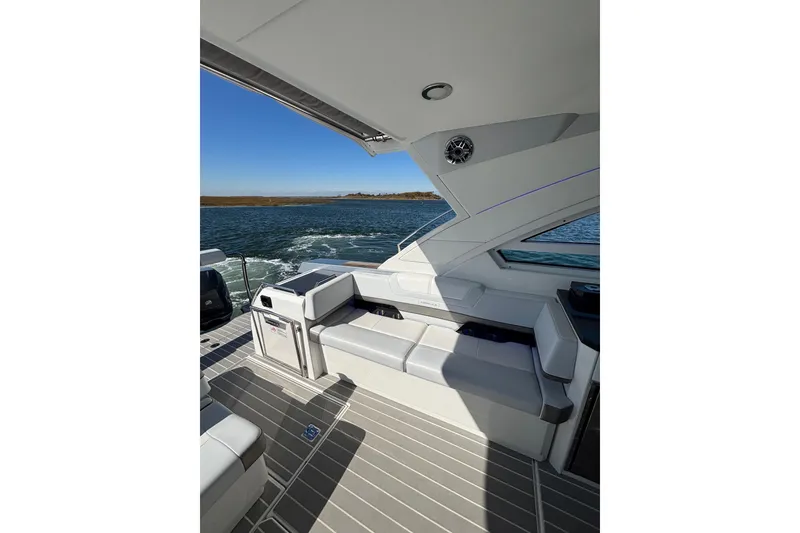 Slide: The Image of 2021 Formula 400 Super Sport Crossover boat interior with seating, on open water. - 37