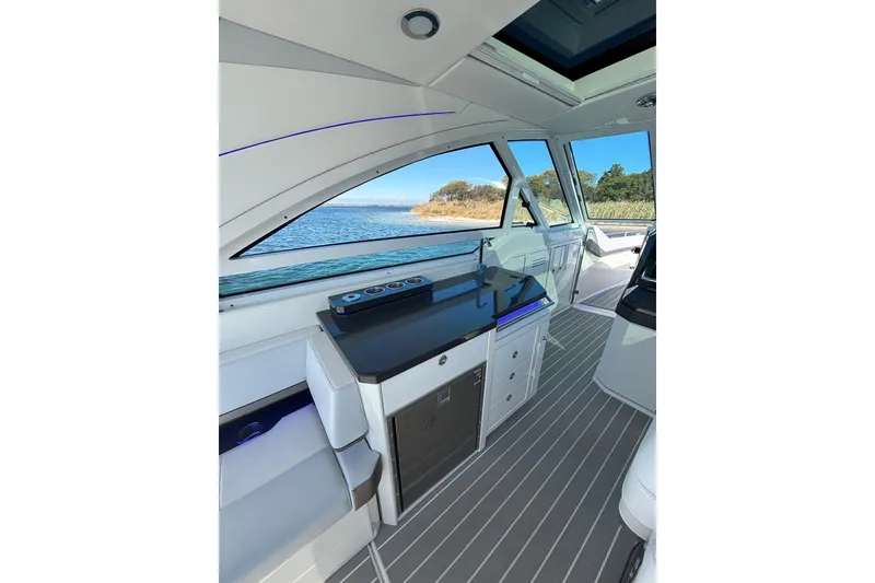 Slide: The Image of 2021 Formula 400 Super Sport Crossover interior with sleek design and waterfront view. - 38
