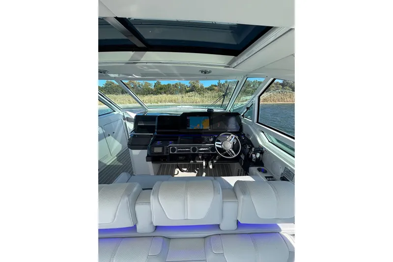 Slide: The Image of Interior view of 2021 Formula 400 Super Sport Crossover boat cockpit with modern controls. - 39