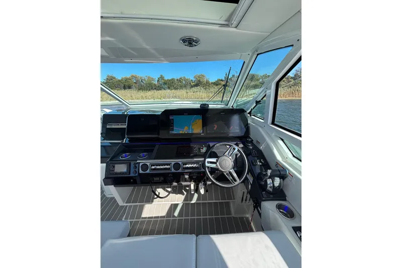 Slide: The Image of 2021 Formula 400 Super Sport Crossover helm with advanced navigation system and sleek design. - 40