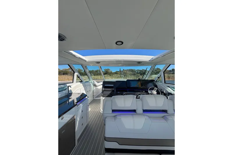 Slide: The Image of Interior of 2021 Formula 400 Super Sport Crossover boat with modern seating and navigation. - 42