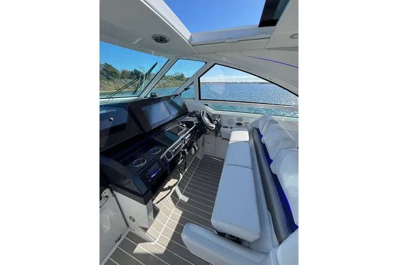 Slide: The Image of 2021 Formula 400 Super Sport Crossover boat interior with modern helm and seating. - 46