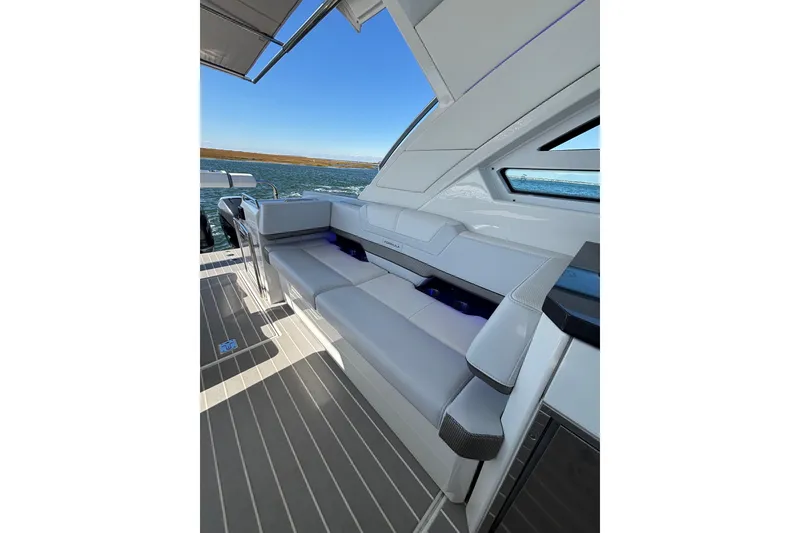 Slide: The Image of 2021 Formula 400 Super Sport Crossover boat interior with sleek seating and modern design. - 48