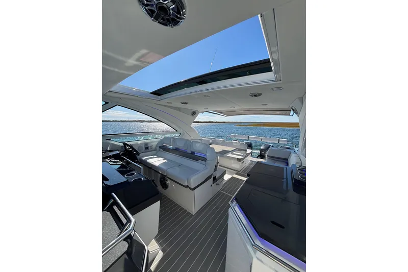 Slide: The Image of 2021 Formula 400 Super Sport Crossover interior with open roof and ocean view. - 50