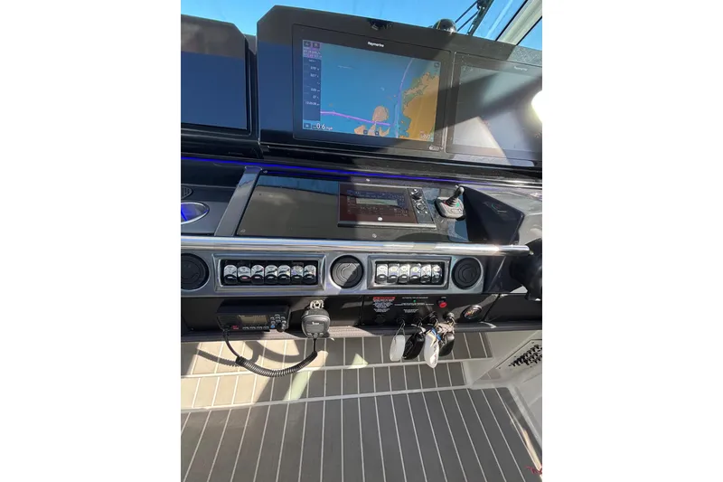 Slide: The Image of 2021 Formula 400 Super Sport Crossover dashboard with navigation screens and controls. - 54