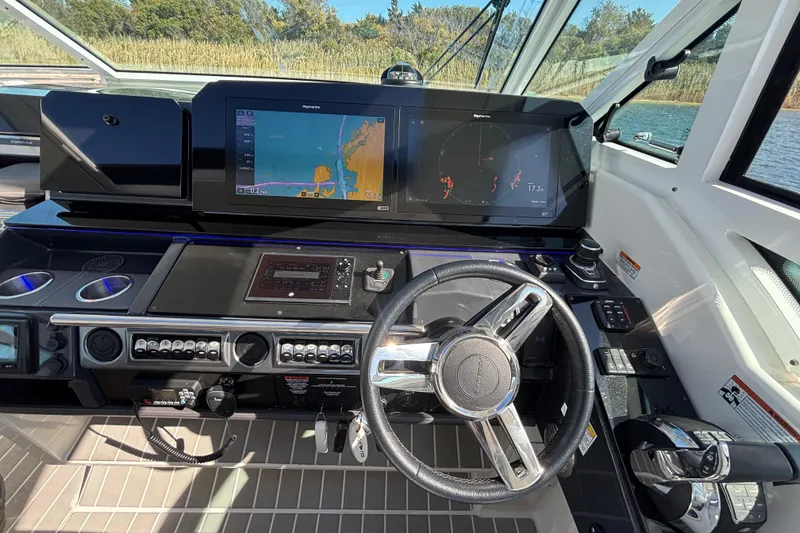 Slide: The Image of Cockpit of 2021 Formula 400 Super Sport Crossover with advanced navigation displays. - 56