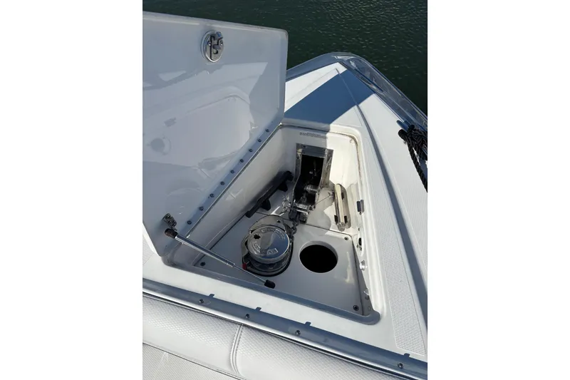 Slide: The Image of 2021 Formula 400 Super Sport Crossover boat anchor compartment open on deck. - 57