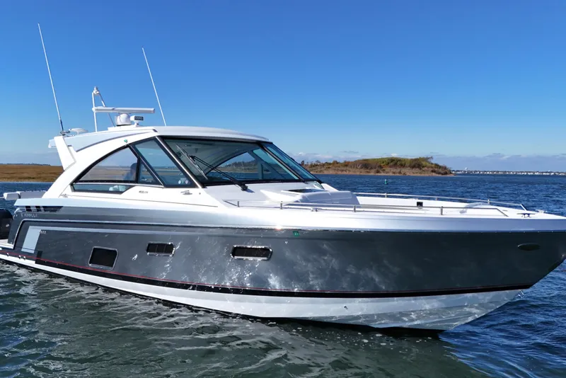 Slide: The Image of 2021 Formula 400 Super Sport Crossover boat cruising on open water. - 6