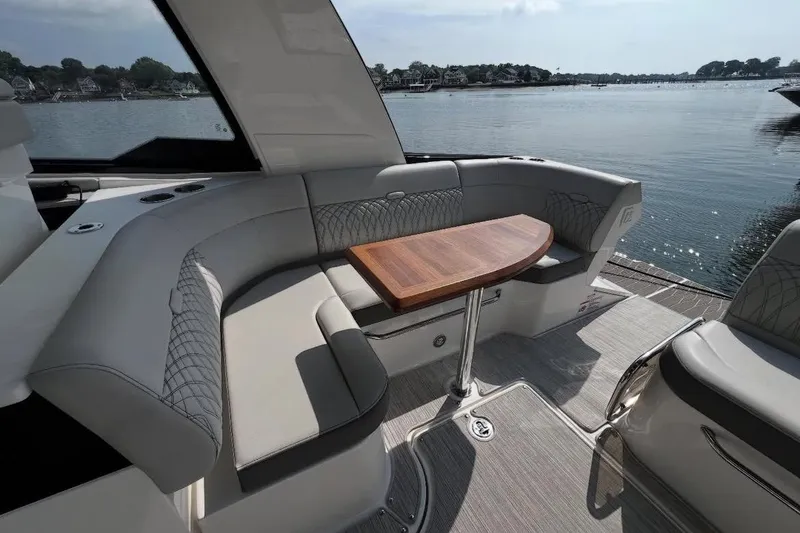 Slide: The Image of 2024 Sea Ray Sundancer 370 helm with advanced navigation and control systems. - 21