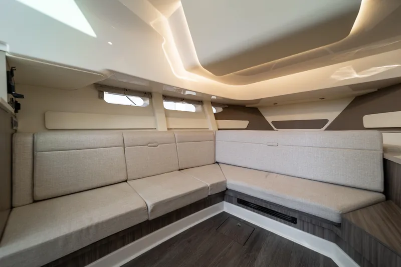 Slide: The Image of Luxurious interior of 2024 Sea Ray Sundancer 370 yacht with modern seating and ambient lighting. - 32