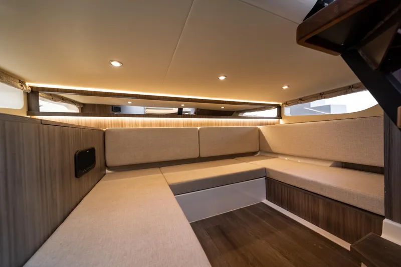 Slide: The Image of Luxurious interior of 2024 Sea Ray Sundancer 370 yacht with elegant seating and ambient lighting. - 34
