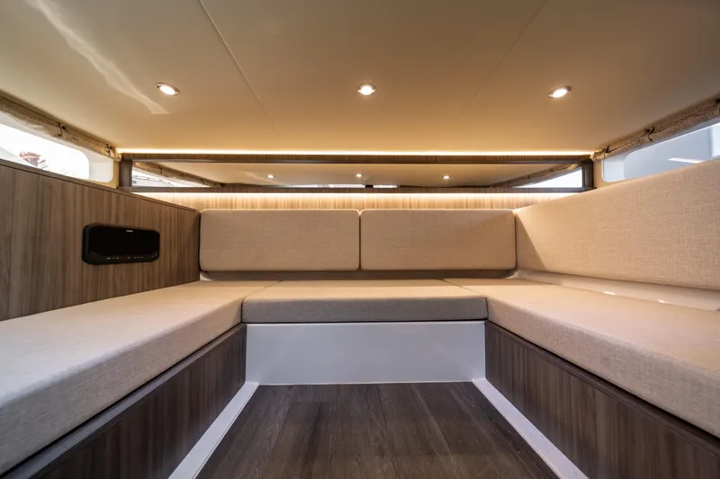 Slide: The Image of Luxurious interior of 2024 Sea Ray Sundancer 370 yacht with elegant seating and ambient lighting. - 35
