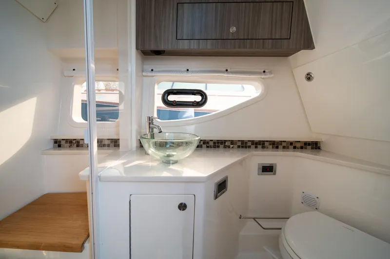 Slide: The Image of Luxurious bathroom interior of 2024 Sea Ray Sundancer 370 yacht with modern fixtures. - 36