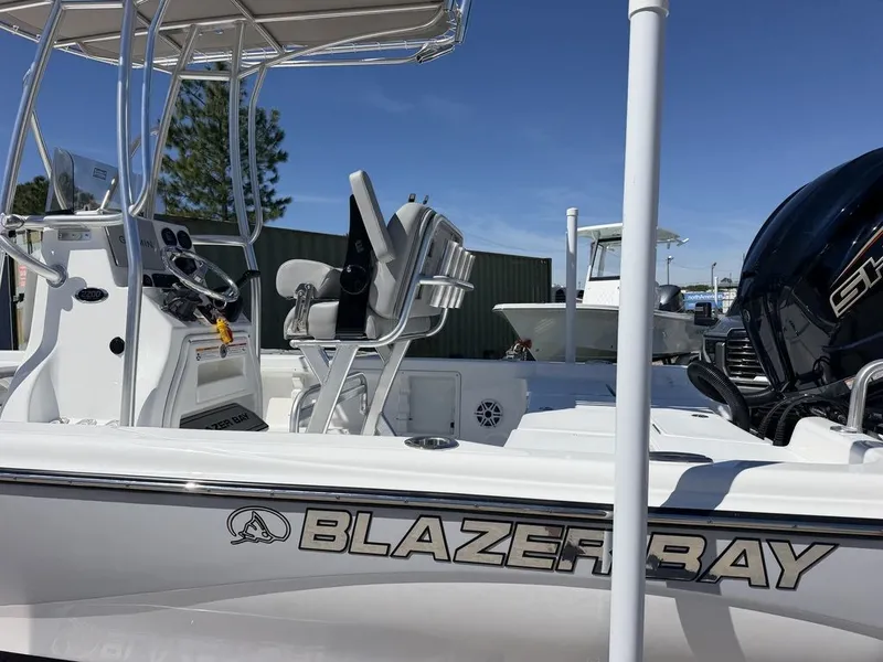Slide: The Image of 2026 Blazer PureBay 2200 boat with helm and engine. - 10
