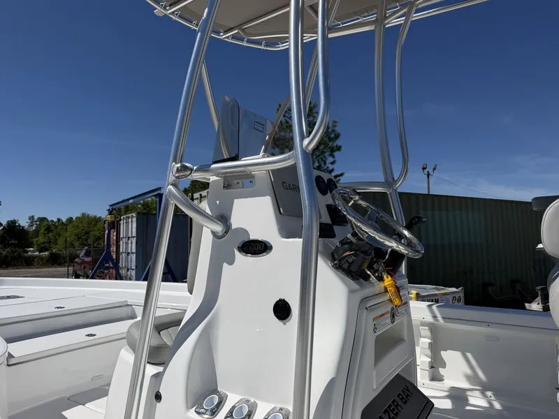 Slide: The Image of Blazer PureBay 2200 boat console, 2026 model, under sunny skies. - 12