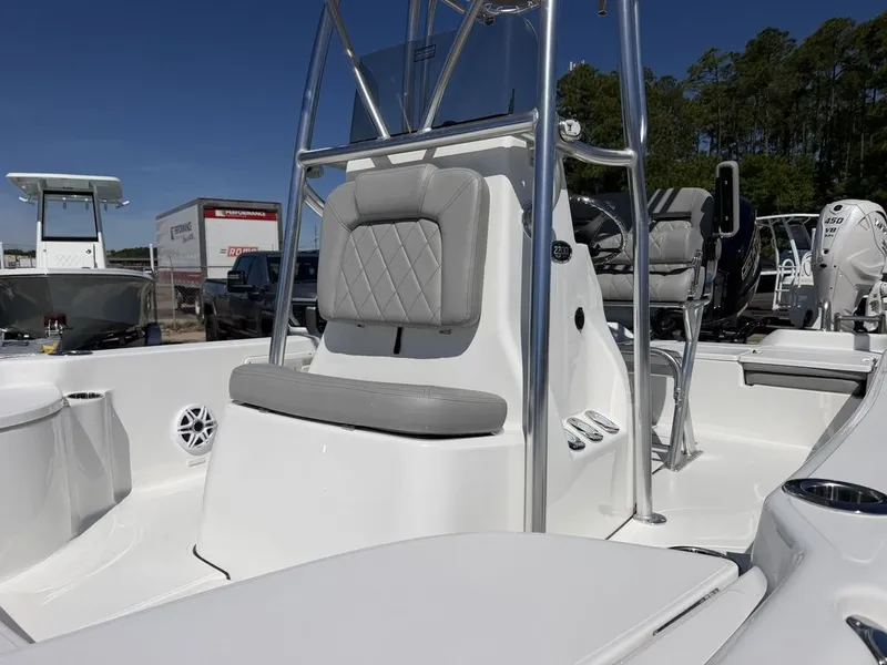 Slide: The Image of 2026 Blazer PureBay 2200 boat with gray seats and stainless steel frame. - 18