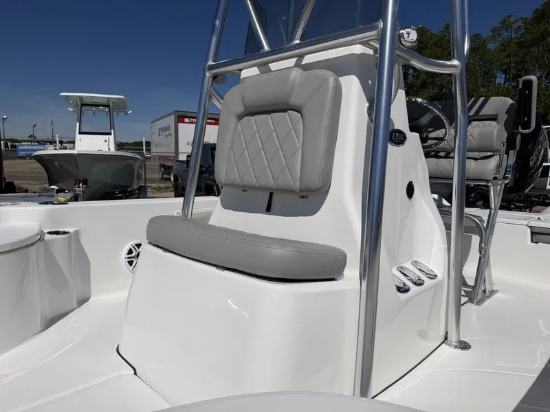 Slide: The Image of 2026 Blazer PureBay 2200 boat with gray upholstery and helm console. - 19