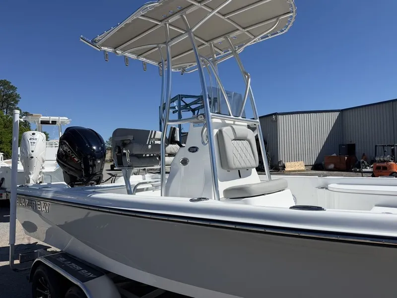 Slide: The Image of 2026 Blazer PureBay 2200 boat with outboard motor and T-top. - 20