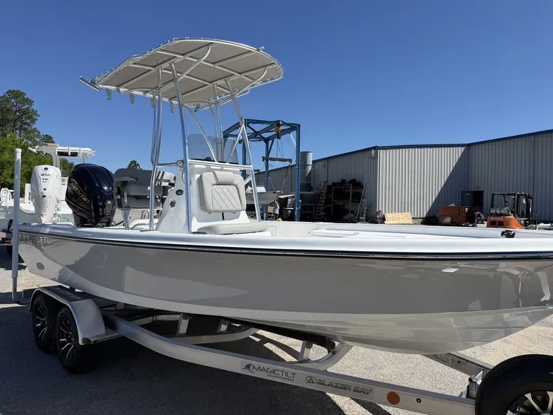 Slide: The Image of 2026 Blazer PureBay 2200 boat on trailer outdoors. - 21