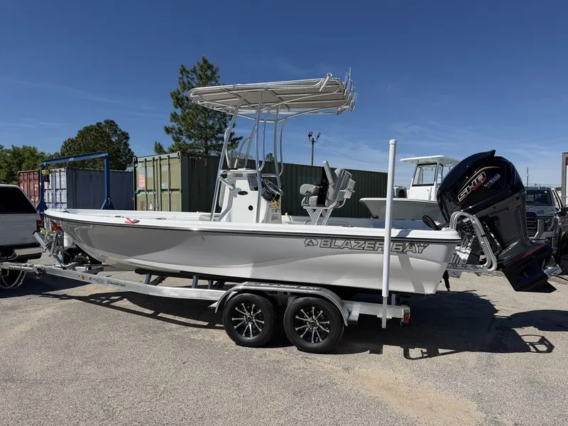 Slide: The Image of 2026 Blazer PureBay 2200 boat on trailer outdoors. - 6